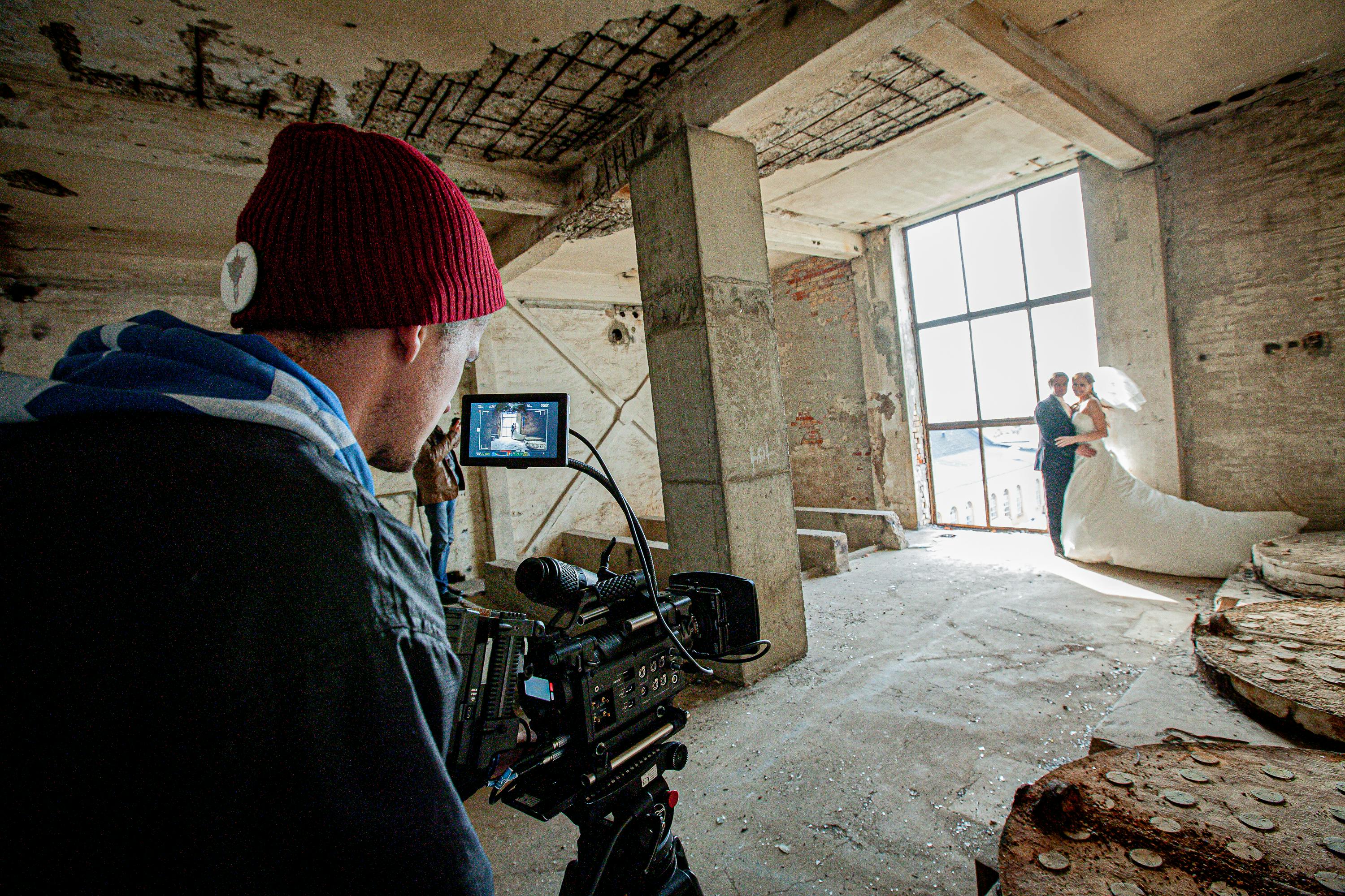 Free A candid moment during a wedding photoshoot in an abandoned building. Stock Photo