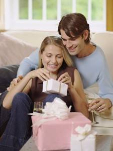 Couple opening wedding gifts