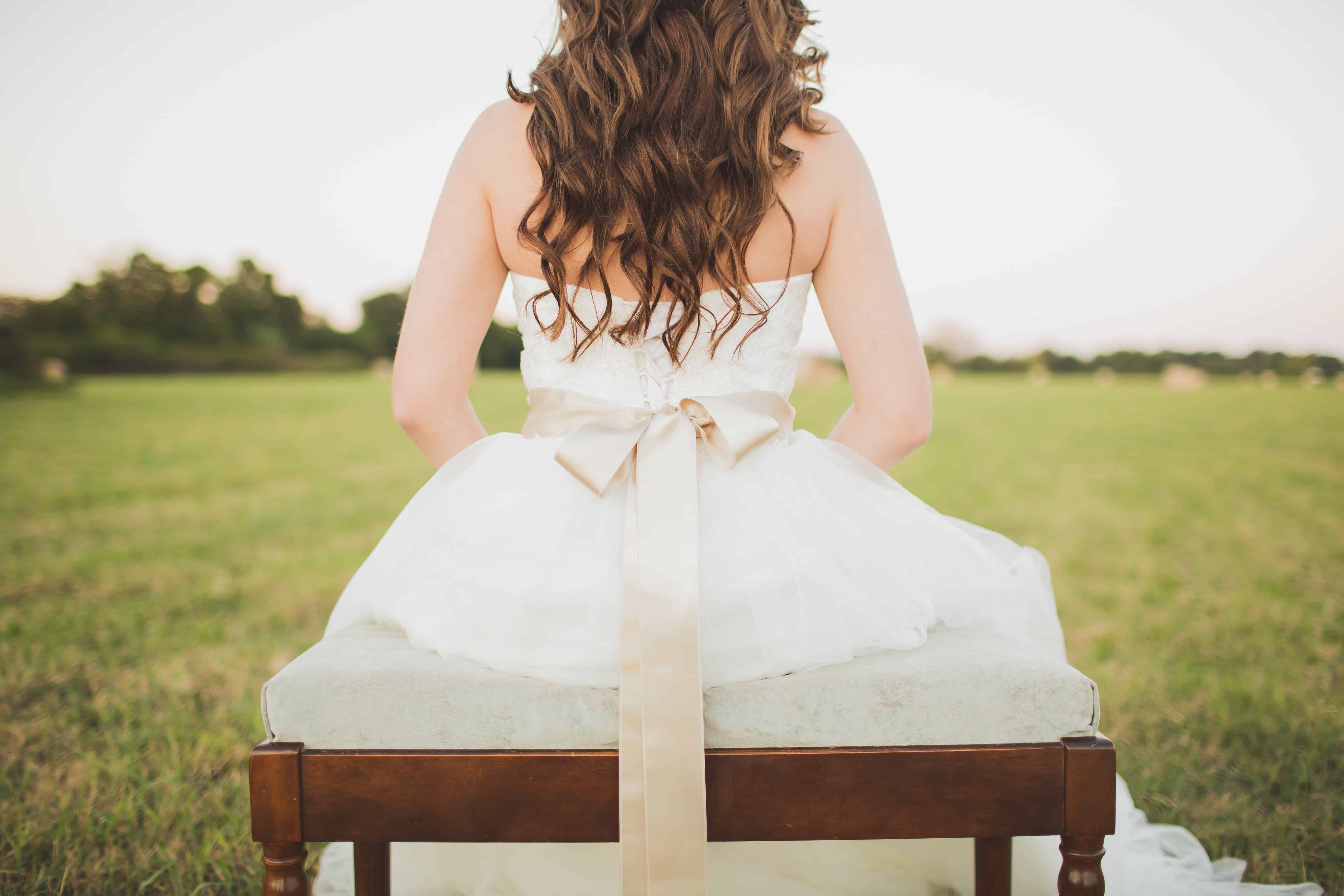 sitting woman wearing white dress