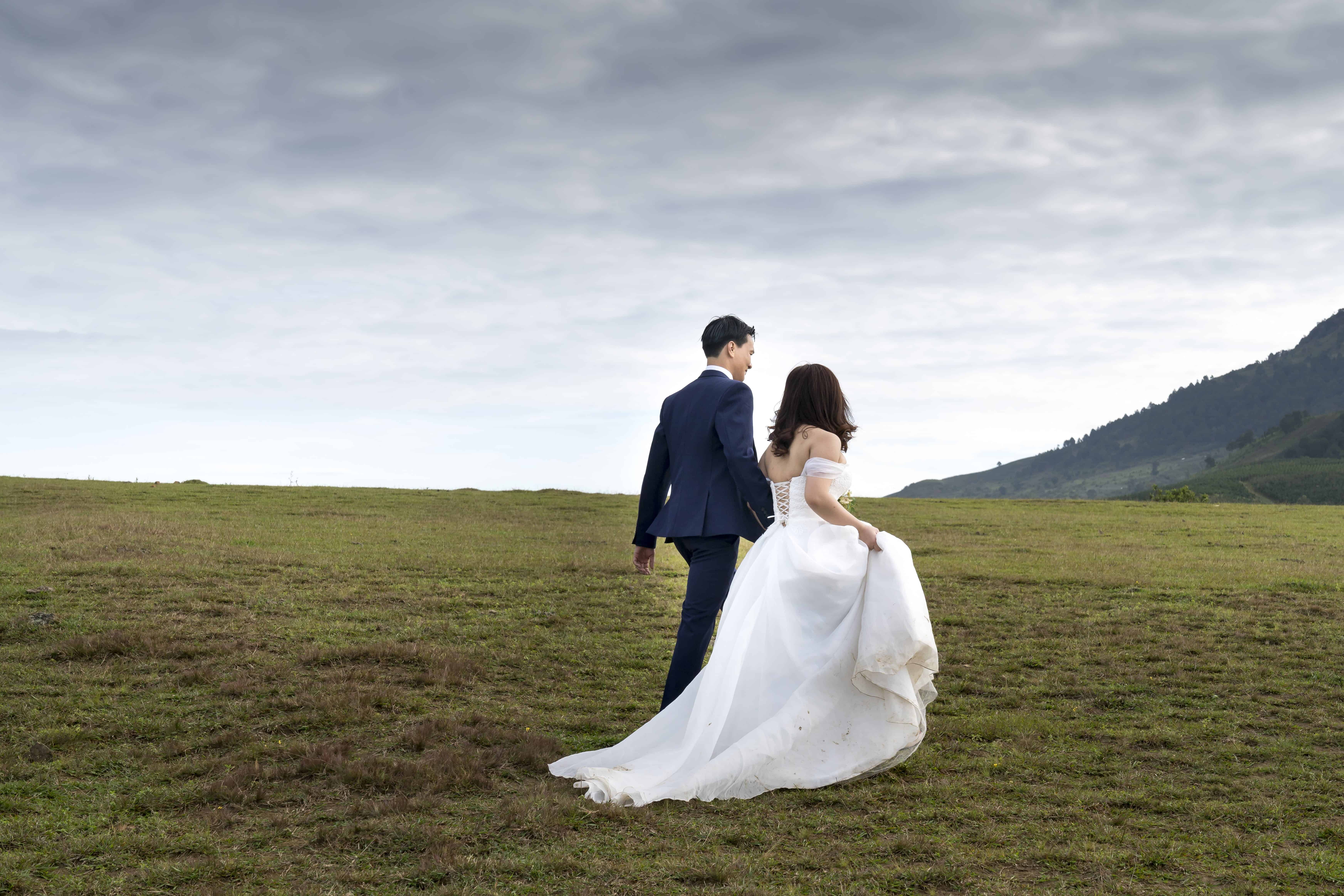 Photo of Couple On Grass Field