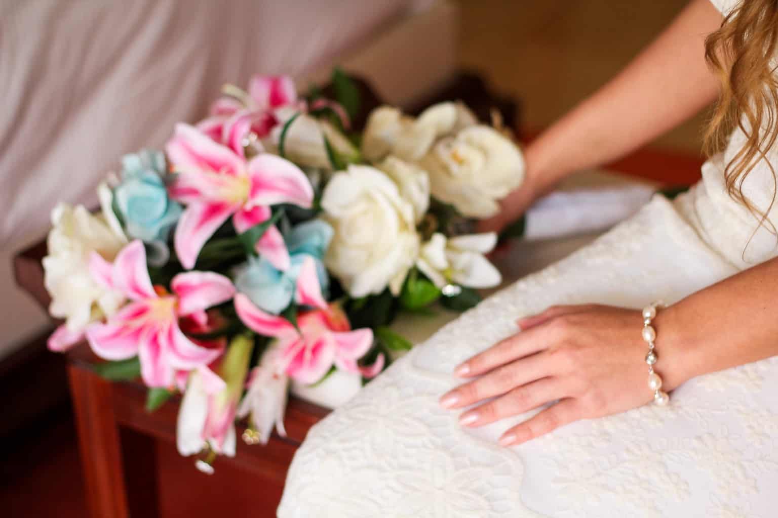 Woman Wearing White Bridal Gown While Holding Assorted-color Bouquet Flowers