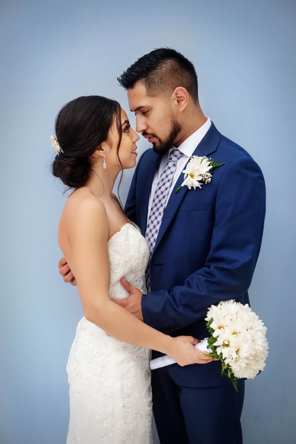 Bride And Groom Standing Next To Each Other