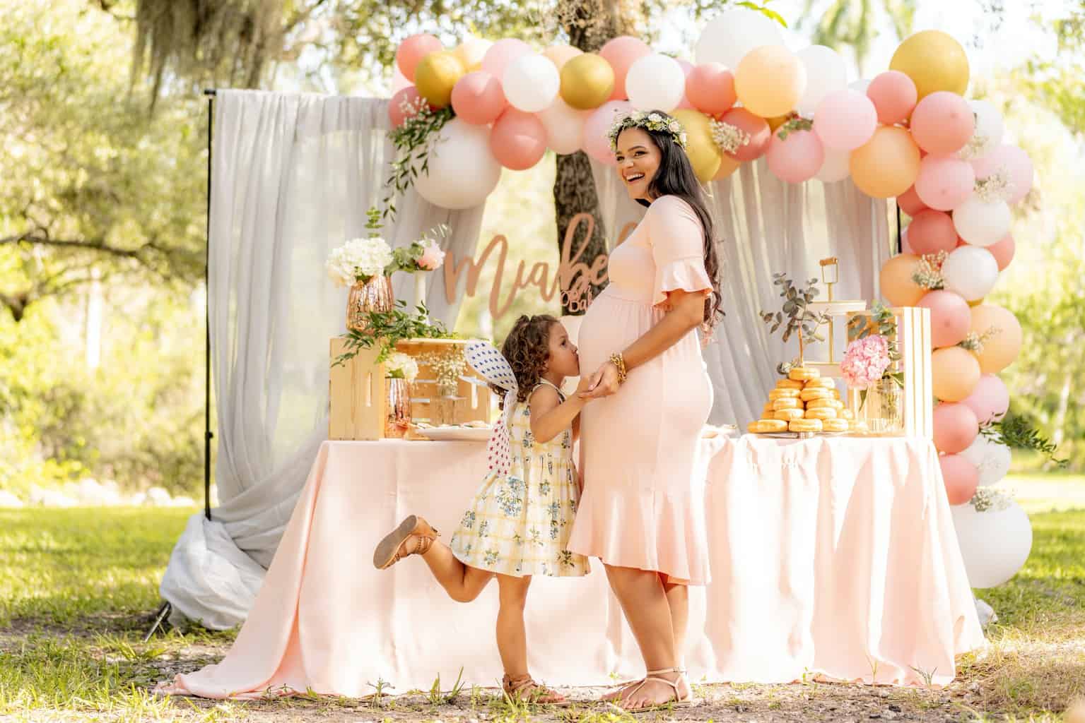 Girl Kissing Her Mother's Belly