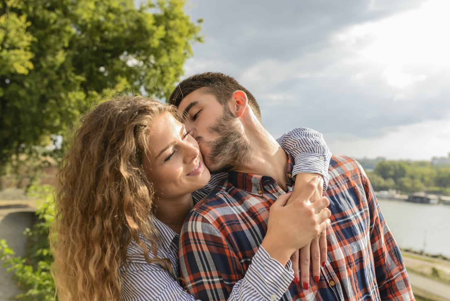 Man Kissing Woman