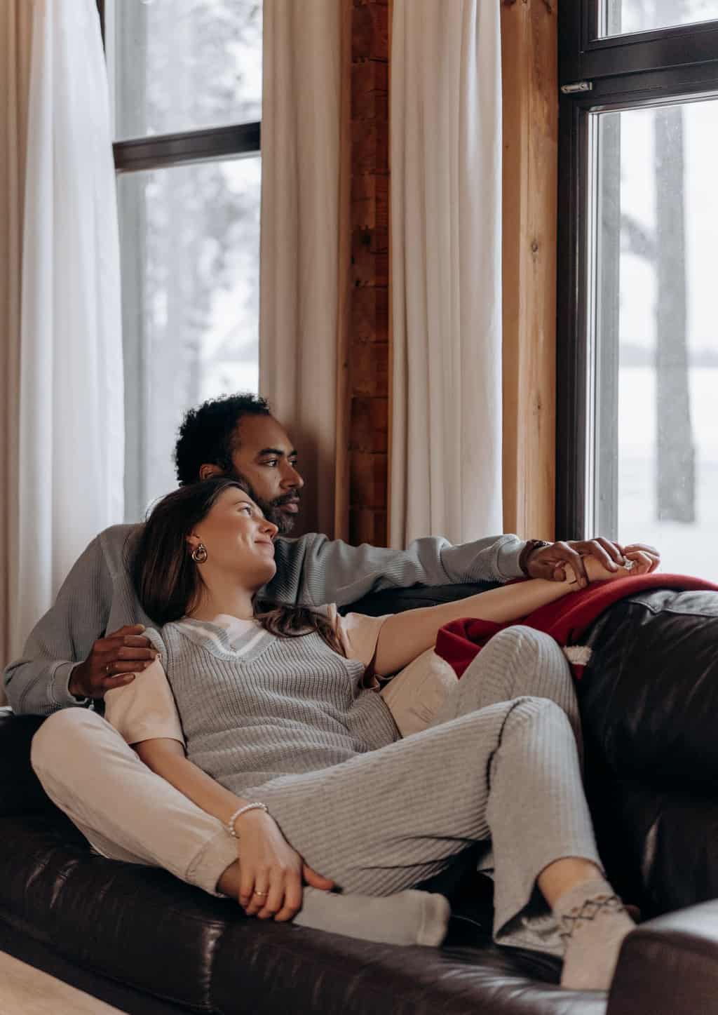 Man and Woman Sitting on Couch