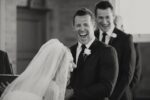 Couple laughing at their own wedding vows